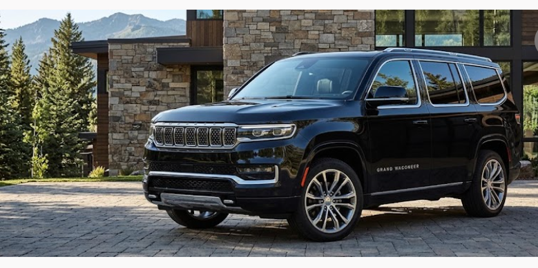 Black Jeep Grand Wagoneer executive SUV parked outside a luxury Colorado mountain resort